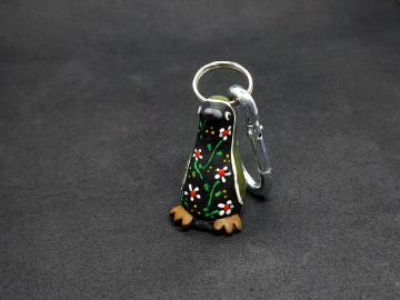 Schlüsselanhänger Kautschuk Pinguin schwarz Blumen