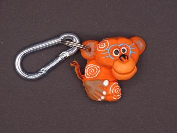 Schlüsselanhänger Kautschuk Affe orange Kringel 